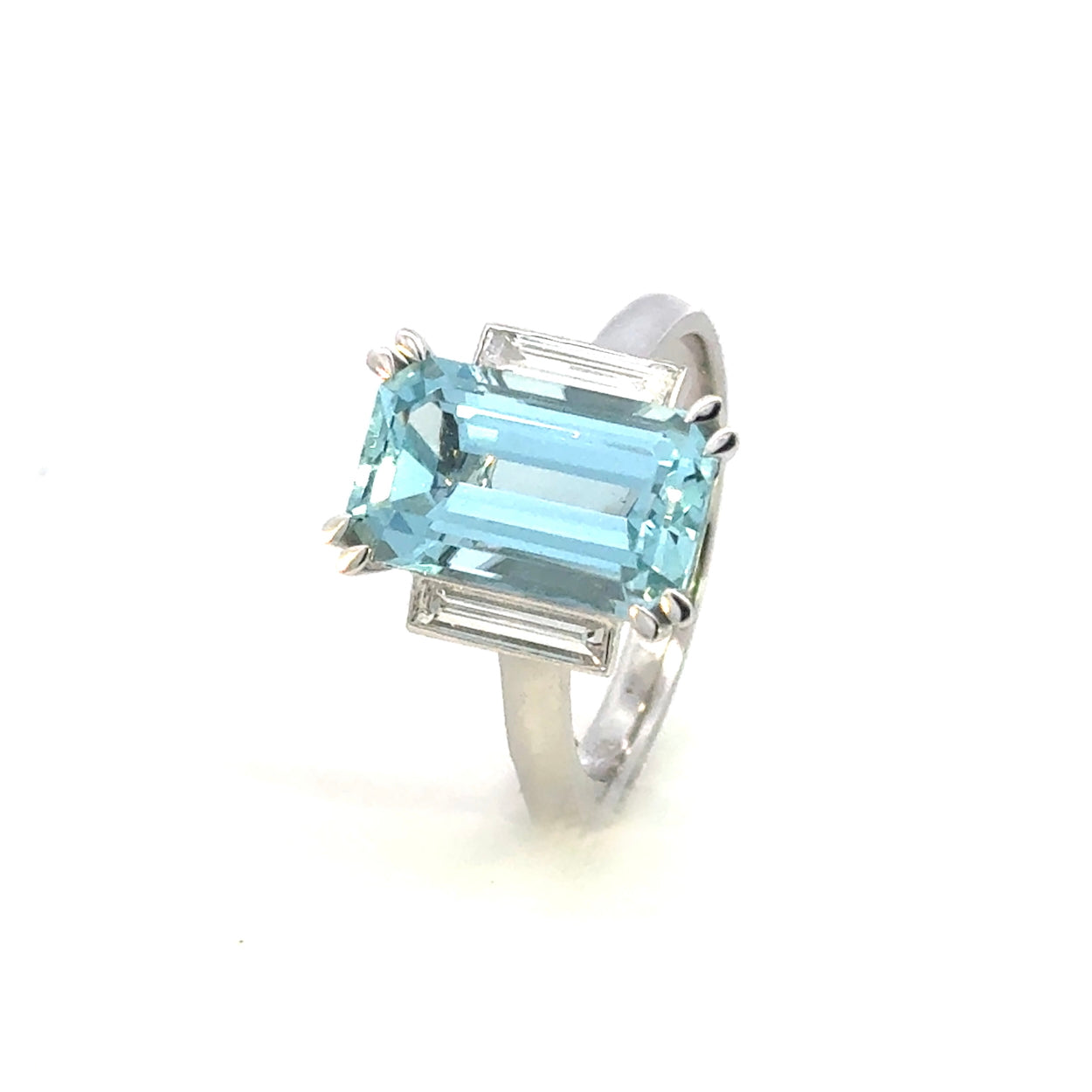 white gold dress ring with emerald cut aquamarine and baguette diamonds