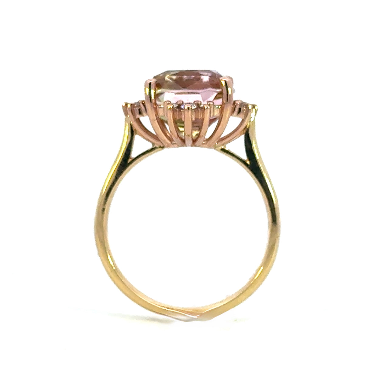 side view of a Gold ring with a pink gold bronze colour gemstone on a white background