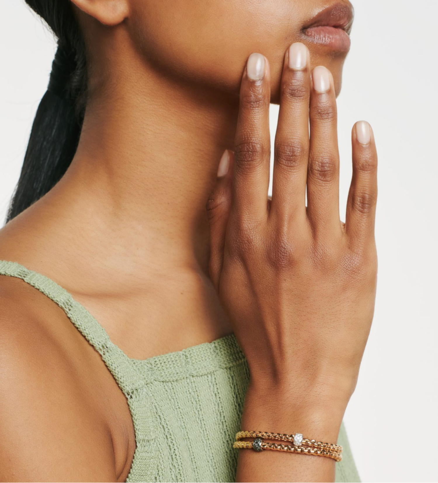 Model wearing the black diamond eka tiny pave bracelet and white diamond pave eka tiny bracelet