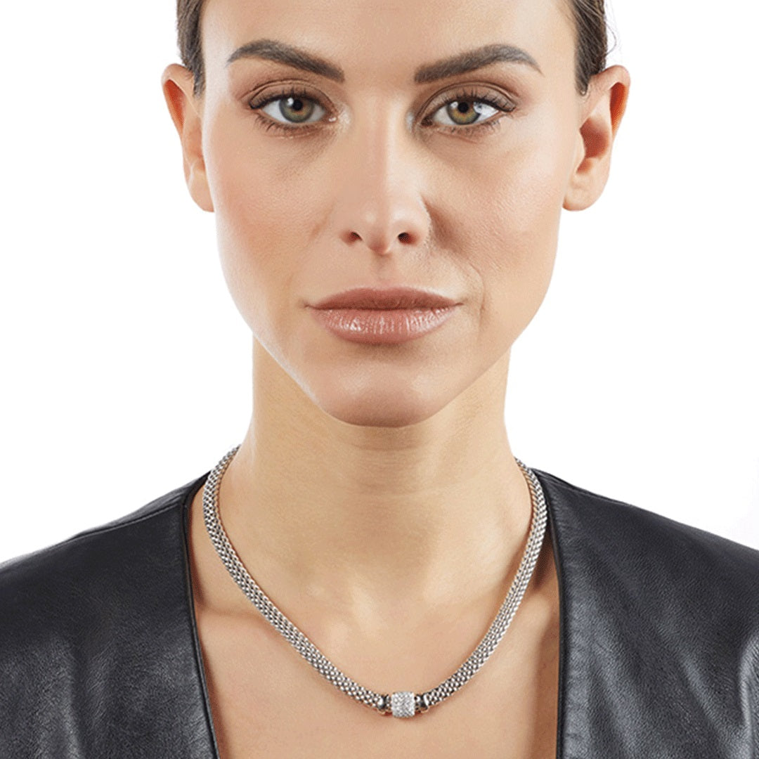 wide white gold necklace with diamond pendant worn on model