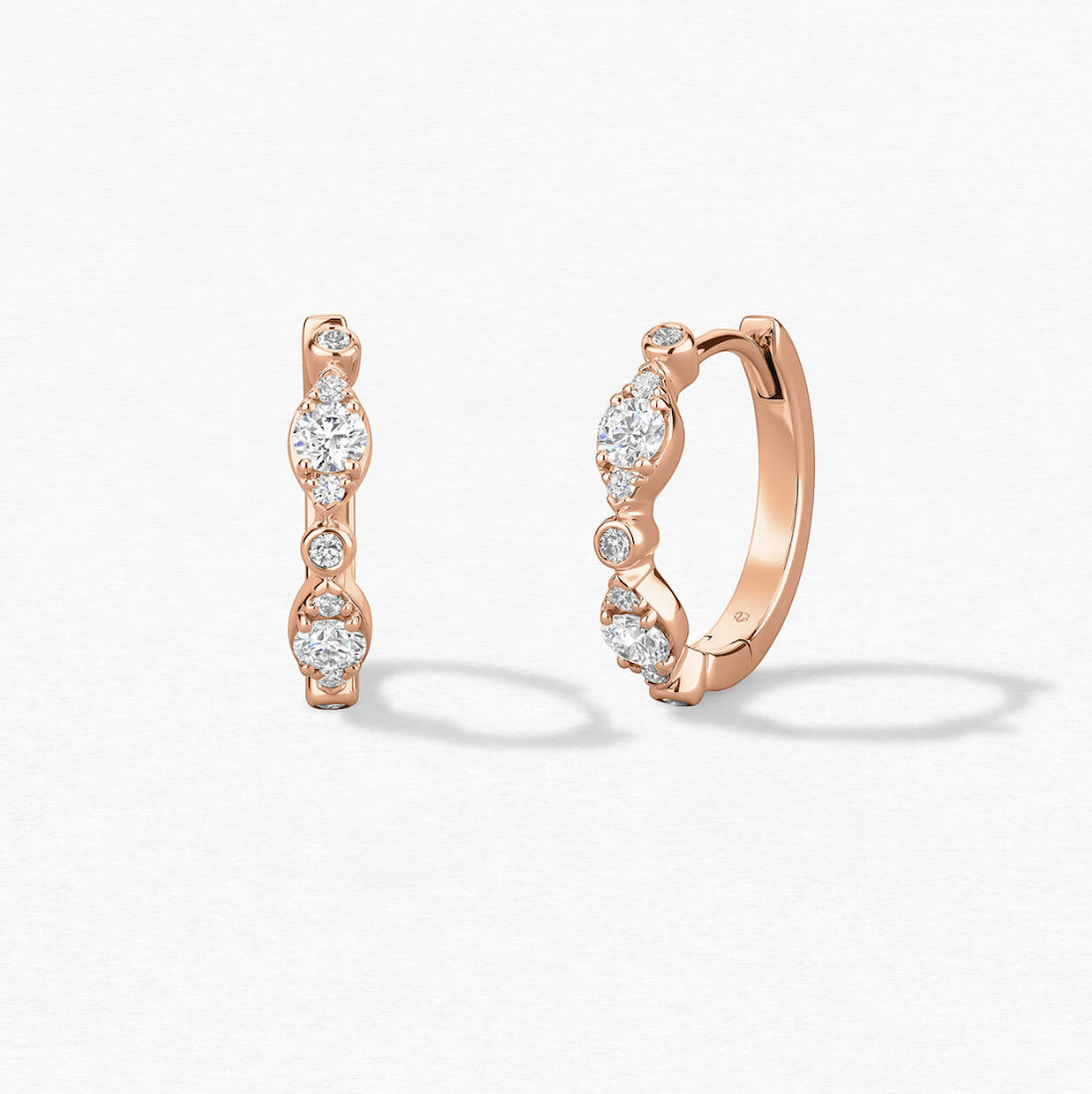 hearts on fire diamond hoop huggie earrings in 18ct rose gold with claw and bezel set diamonds