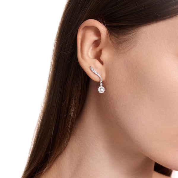 Diamond drop earrings on model
