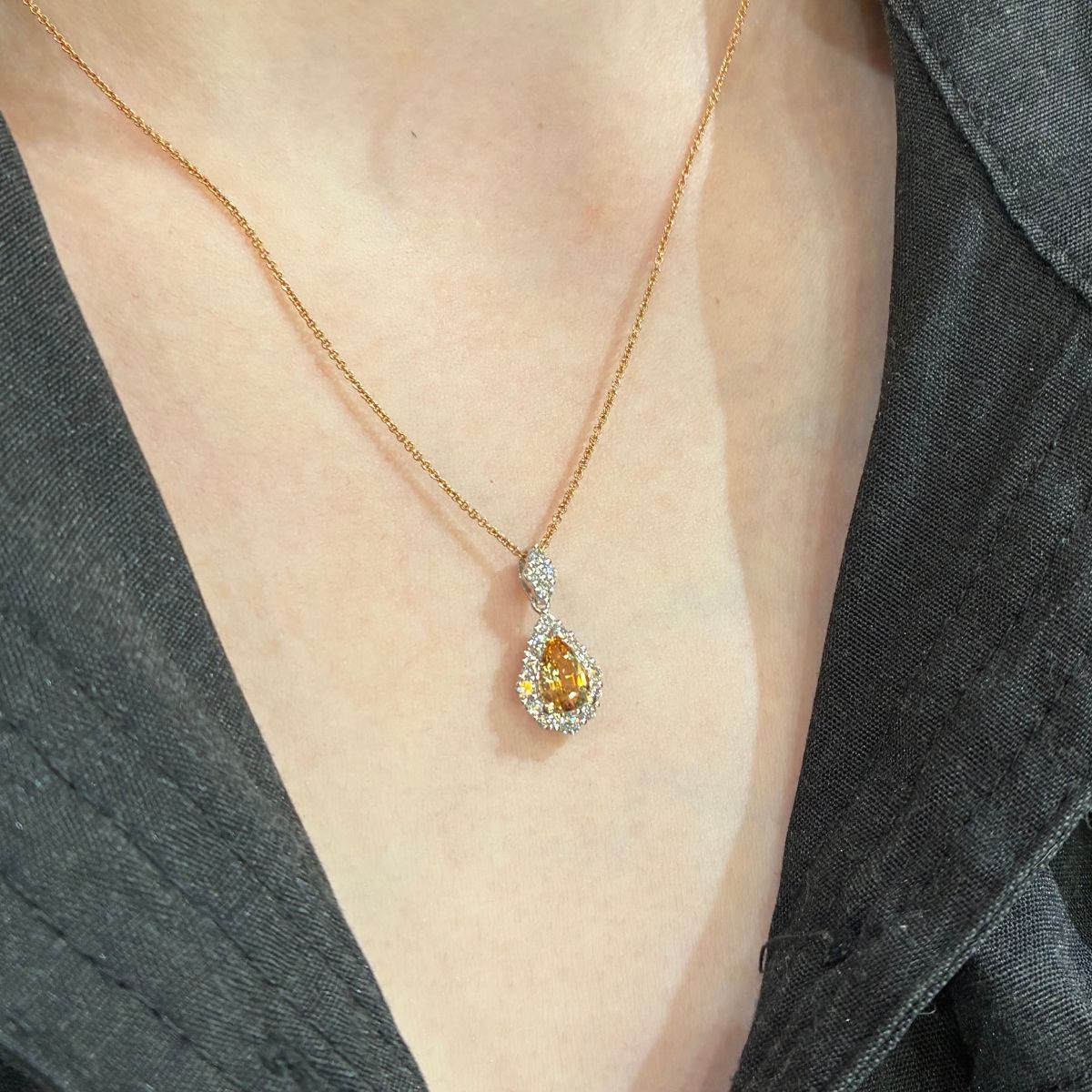 Imperial Topaz and Diamond Pear shape pendant worn on lady