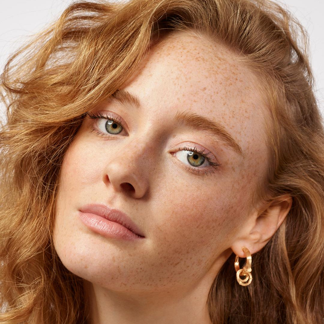 Ole Lynggaard Nature Creol hoop earrings worn with pendants