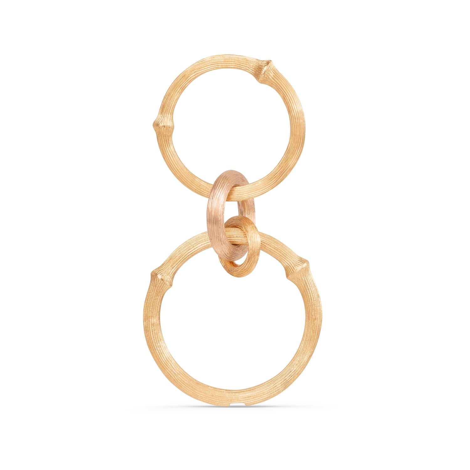 Ole Lynggaard Nature ring with 3 ring pendant attached
