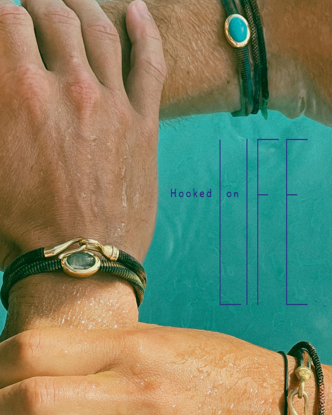 Person wearing Ole Lynggaard Life bracelets