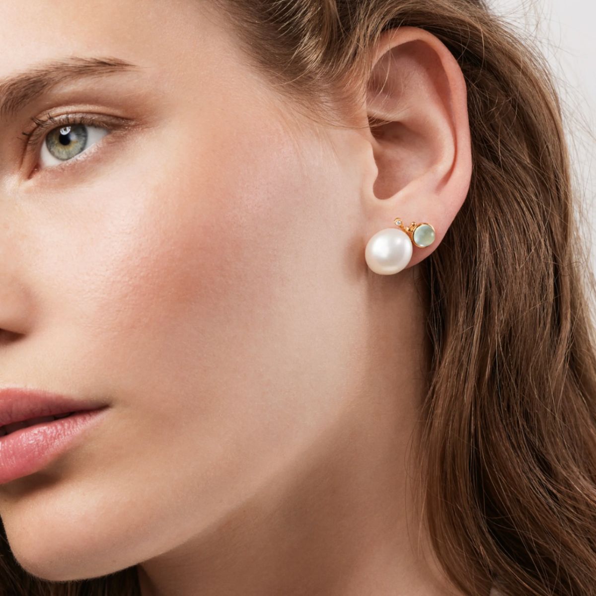 Model wearing Ole Lynggaard Pearl BoHo earrings with Aquamarine