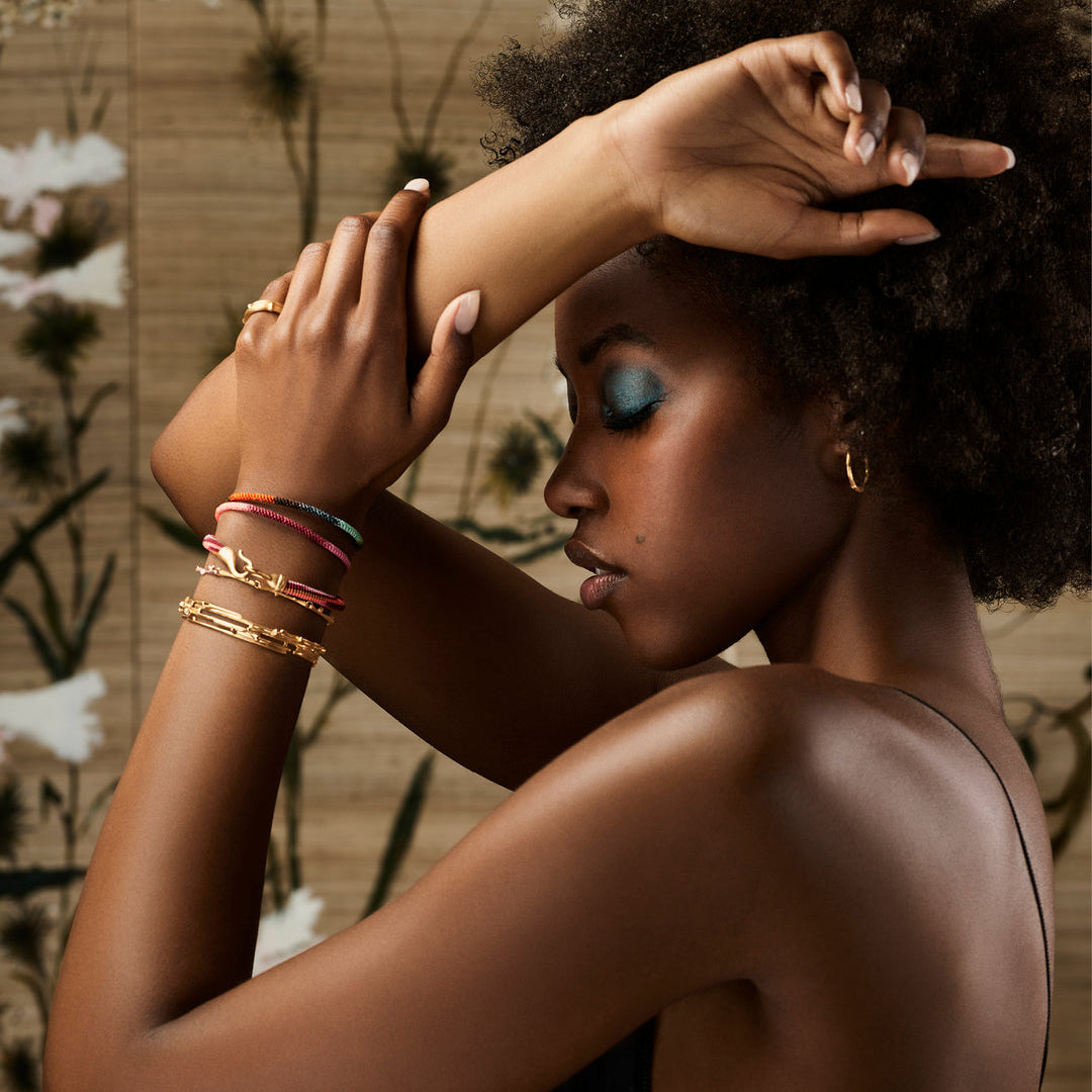 Woman wearing A selection of Ole Lynggaard bracelets