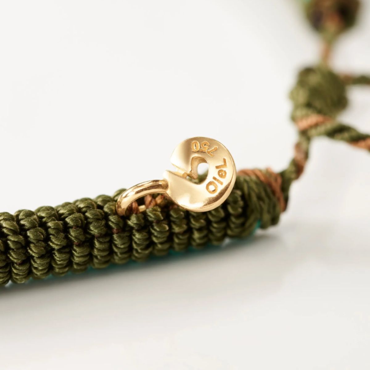 Ole Lynggaard Mocha new life bracelet close up of gold accent