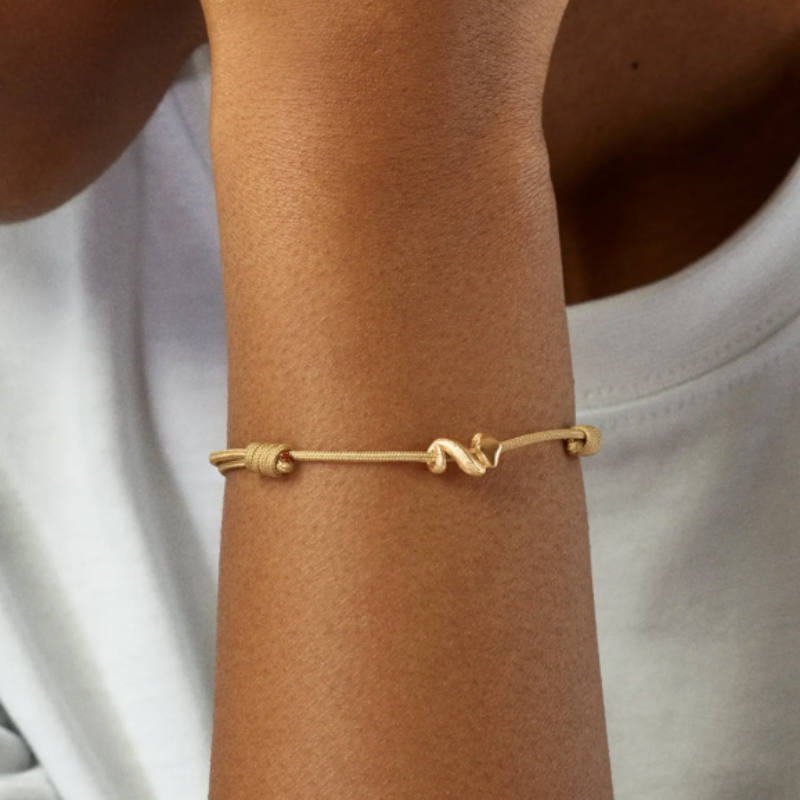 OLC beige snakes string bracelet