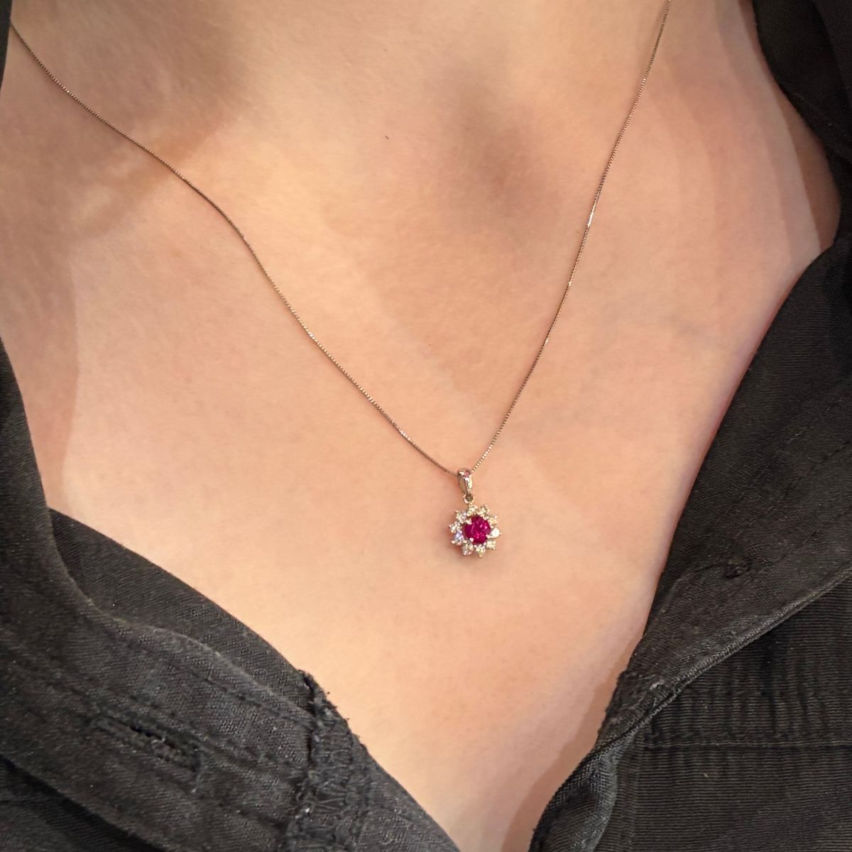 Ruby and Diamond cluster pendant in white old worn on lady Trewarne design