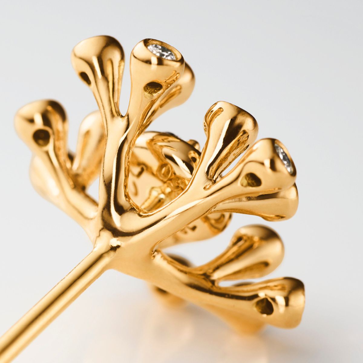 Ole Lynggaard Wild Rose stud close up on design