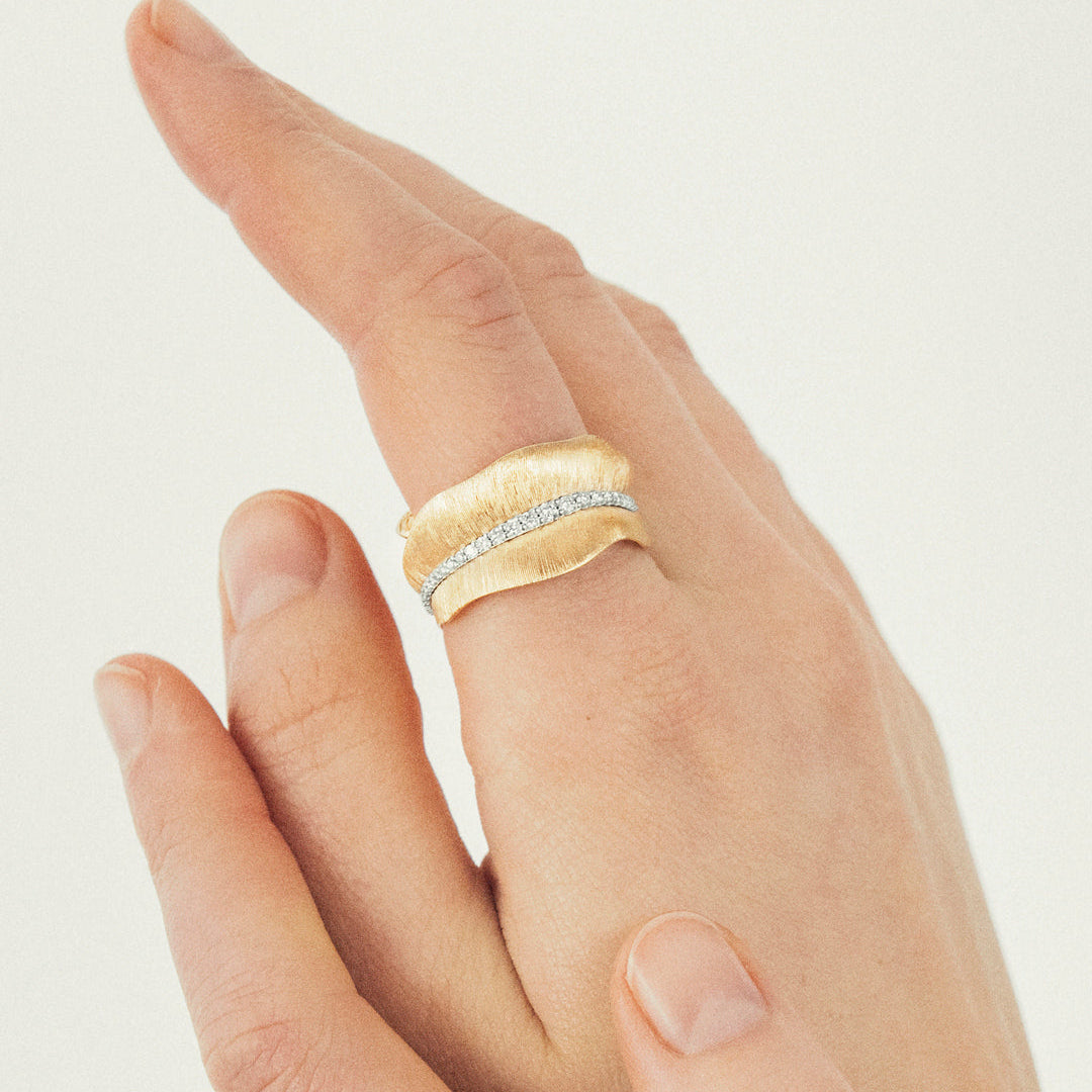 Ole Lynggaard Leaves rIng medium with diamonds being worn on finger