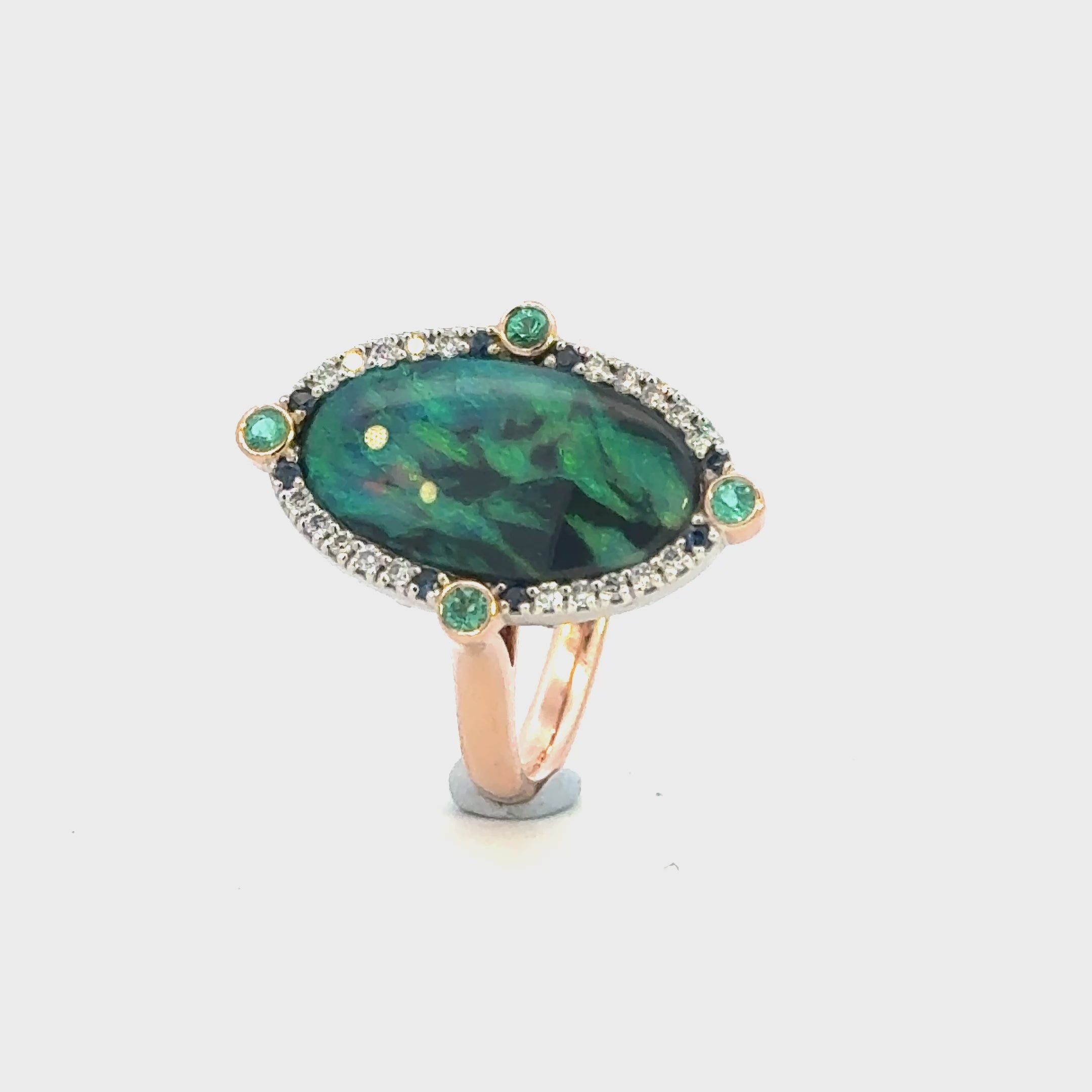 Handcrafted Australian solid black opal ring with diamonds, Australian sapphires and Paraíba tourmaline, vivid blue green colour play, Melbourne jewellery designer Trewarne.