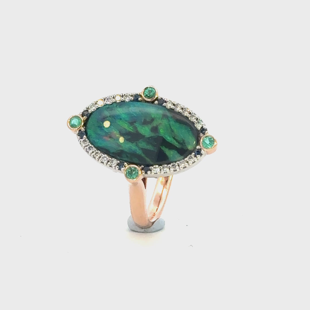 Handcrafted Australian solid black opal ring with diamonds, Australian sapphires and Paraíba tourmaline, vivid blue green colour play, Melbourne jewellery designer Trewarne.