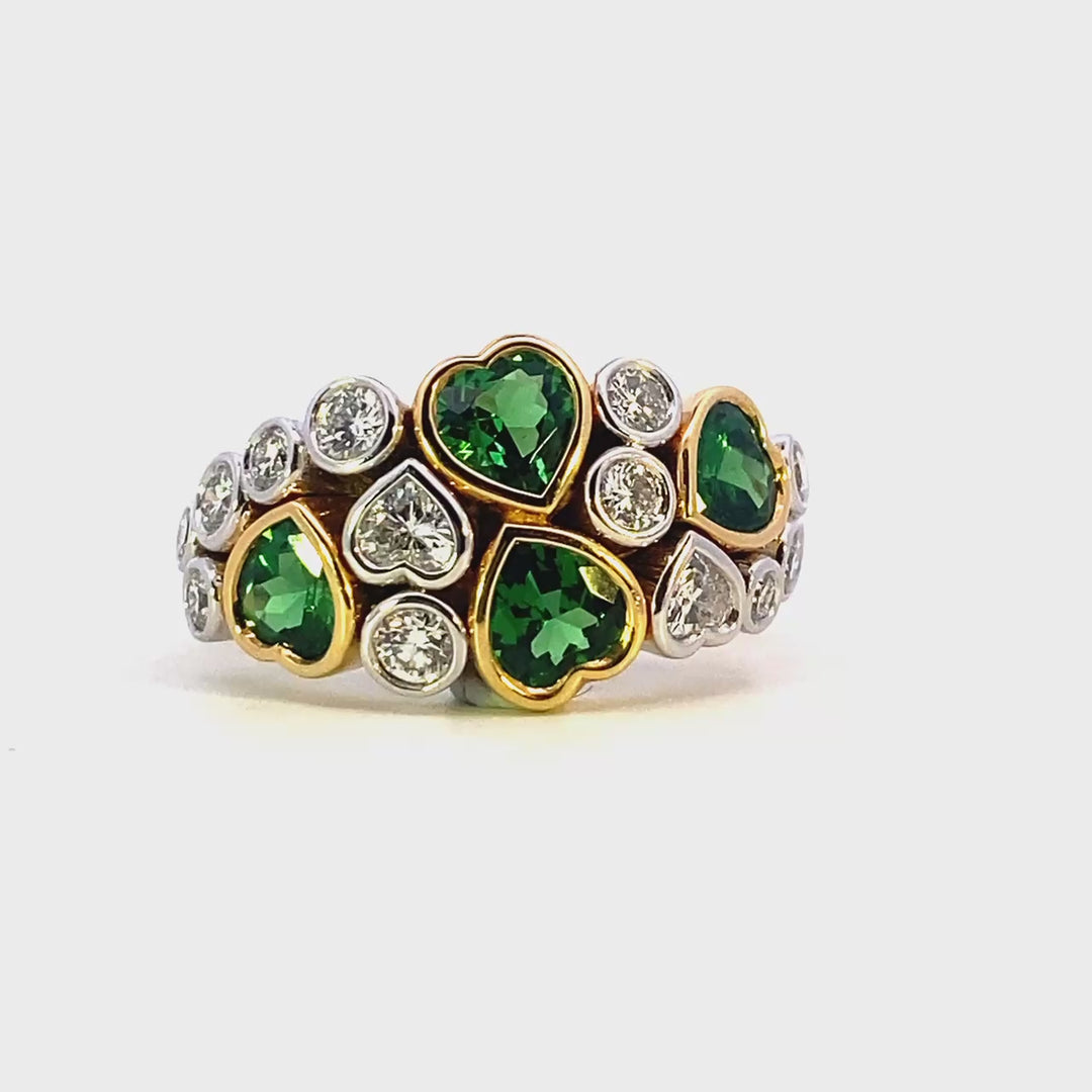 tsavorite garnet and diamond ring with round and heart shape diamonds and garnets. Trewarne original design made in 18ct yellow and white gold