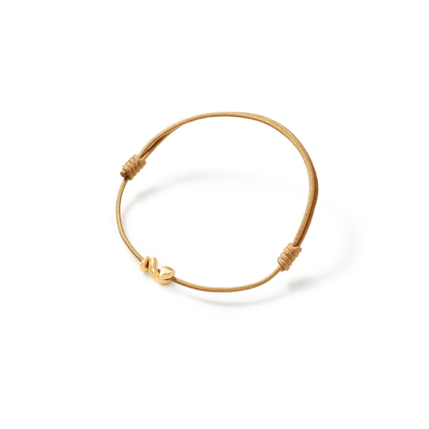 Ole Lynggaard snake bracelet on beige string