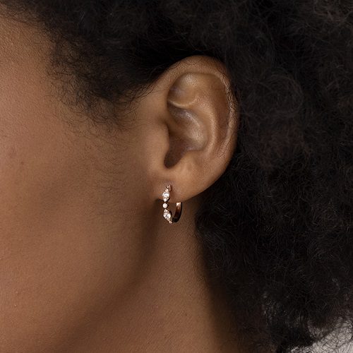 HOF BEZEL REGAL HUGGIE earring on womans ear